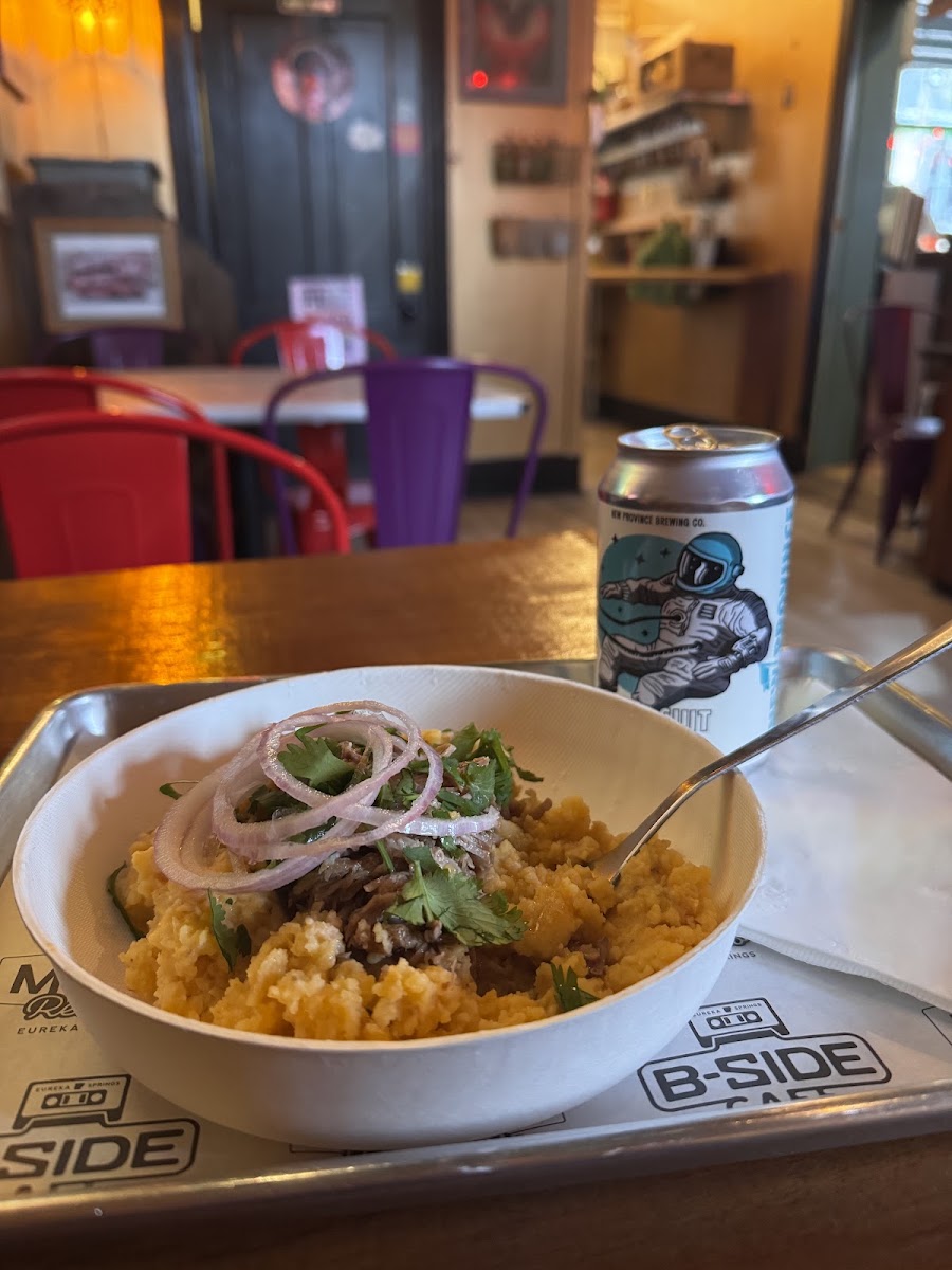 Food and drink on a tray bearing B-Side Cafe branding