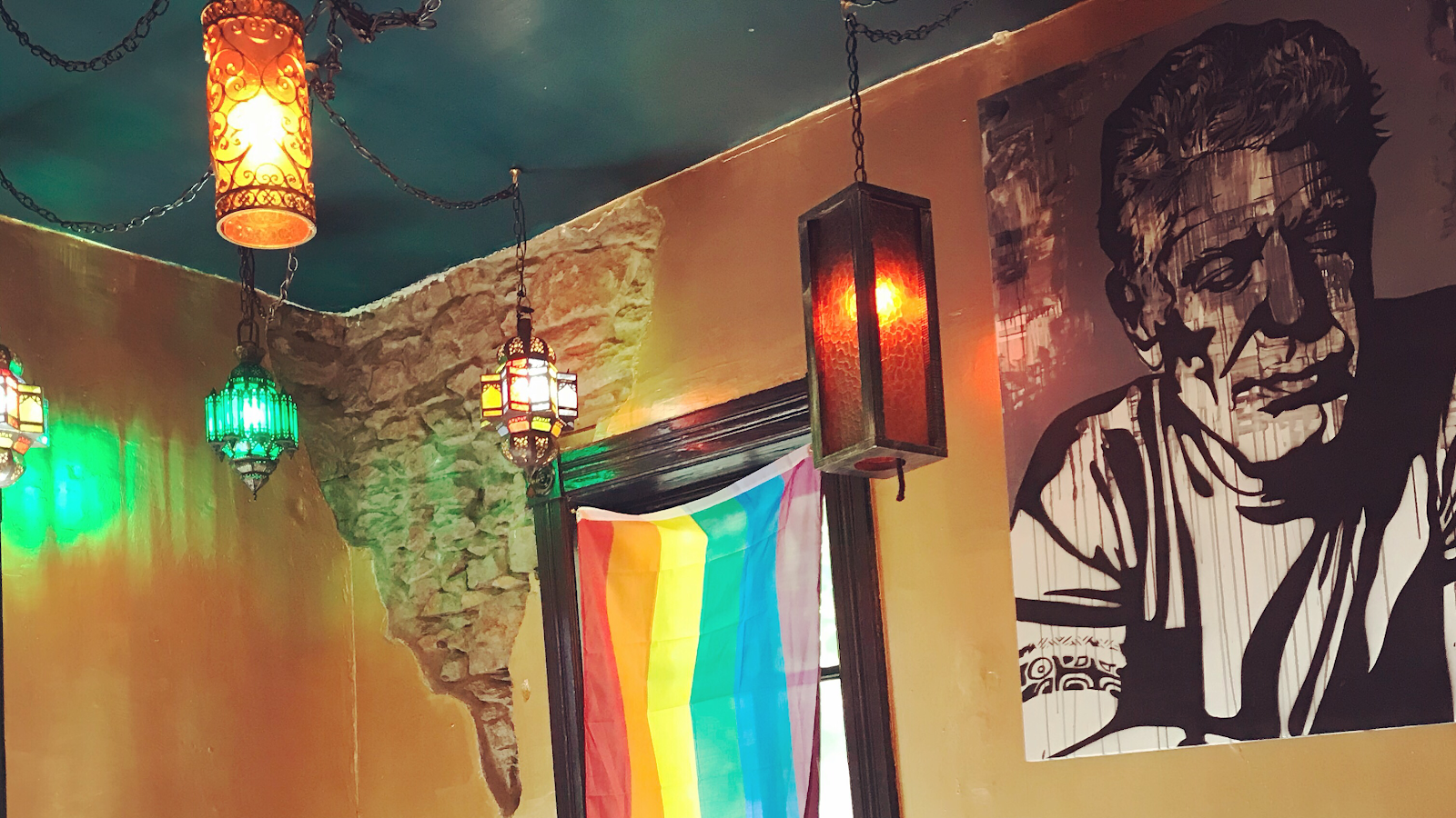 B-Side Cafe interior with colorful hanging lanterns and wall art